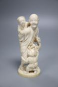 A Japanese Tokyo school ivory group of a farmer and children, Meiji period, height 16cm