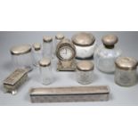 An Edwardian silver mounted balloon shaped timepiece, 11.5cm and sundry mounted toilet jars.