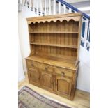 An 18th century style oak dresser, width 144cm, depth 46cm, height 194cm