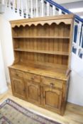 An 18th century style oak dresser, width 144cm, depth 46cm, height 194cm