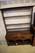 An 18th century George III oak dresser, width 135cm, depth 40cm, height 185cm