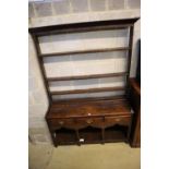 An 18th century George III oak dresser, width 135cm, depth 40cm, height 185cm