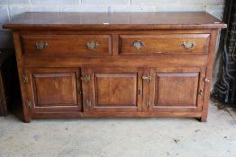 An 18th century style oak low dresser, width 168cm, depth 58cm, height 86cm