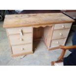 A pine kneehole dressing table, width 129cm, depth 49cm, height 74cm
