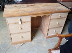 A pine kneehole dressing table, width 129cm, depth 49cm, height 74cm