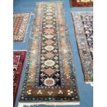 A Caucasian indigo runner with dedication, 280 x 80cm