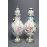 A pair of Minton style ovoid vases and covers, decorated with roses, 37cm