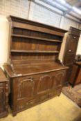 An 18th century oak mule chest with associated rack, width 151cm, depth 54cm, height 180cm