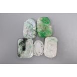 Four Chinese jadeite plaques and a similar belt plaque, 4 - 5.4cm