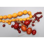 A single strand graduated amber bead necklace, 48cm, gross 40 grams, a large amber bead 10 grams and