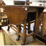 An early 18th century oak gateleg table, width 105cm, depth 38cm, height 70cm