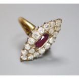 A yellow metal, ruby and diamond cluster set marquise shaped dress ring, shank has been cut and