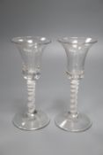 A pair of cotton thread stem wine glasses, c.1760, with teared bell shaped bowls, 18cm