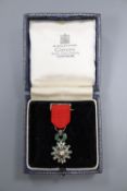 A French diamond set miniature Legion d'honneur medal