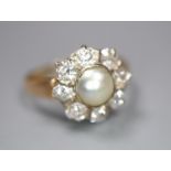A yellow metal, cultured pearl and diamond set flower head cluster ring, size L, gross 3.1 grams,
