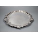 A modern circular silver salver with shell and scroll border on claw and ball feet, Birmingham,