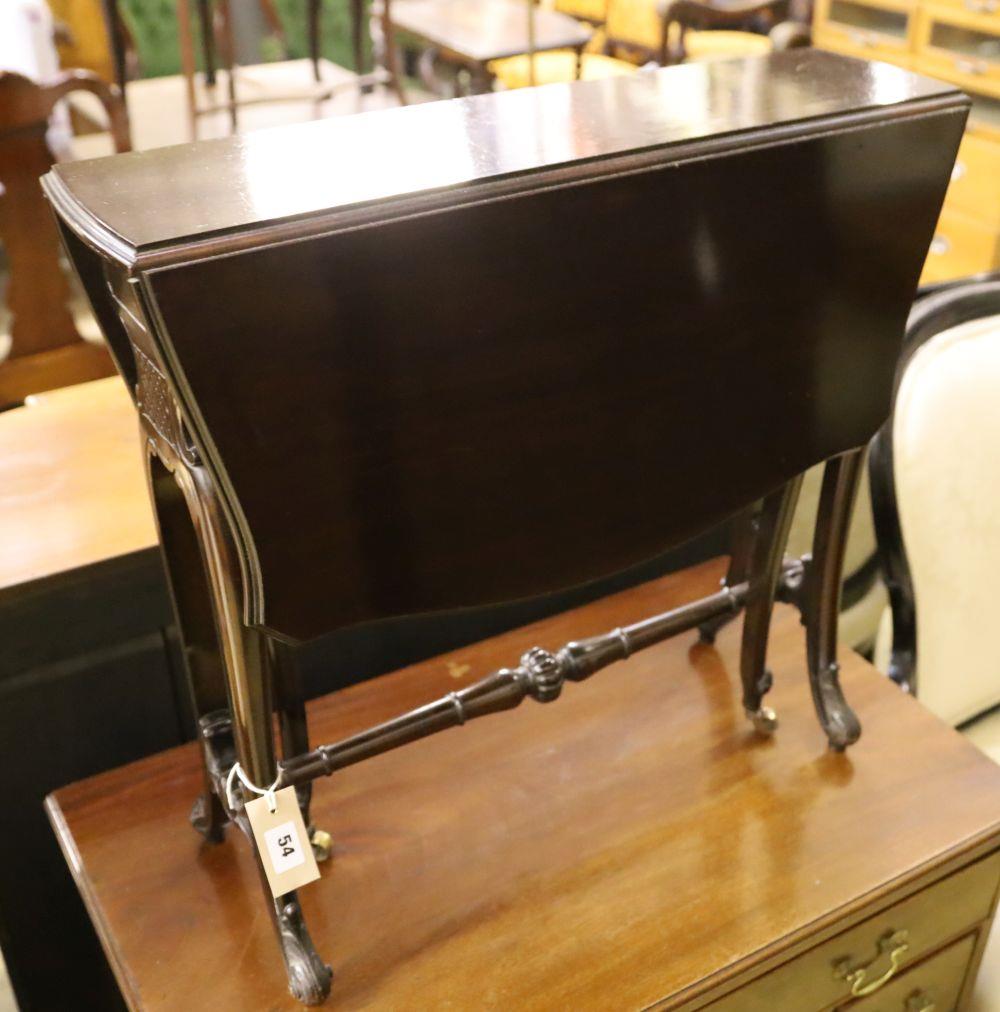 A late Victorian mahogany Sutherland table with shaped top on carved underframe, width 63cm depth