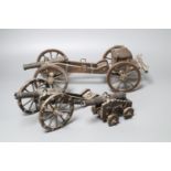 Three oak and wrought iron models of historic cannons, longest 39cm