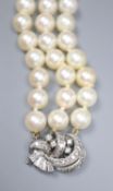 A triple strand cultured pearl bracelet, with diamond set white metal clasp, 17.5cm, gross 38.7