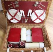 A wicker cased picnic set