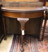 An early 20th century mahogany folding demi lune card table, width 83cm, depth 42cm, height 75cm,