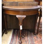 An early 20th century mahogany folding demi lune card table, width 83cm, depth 42cm, height 75cm,