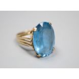 A modern 9ct god and blue paste? set oval dress ring, size K, gross 5.5 grams.