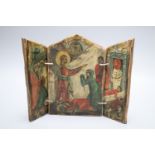 A small painted wood triptych, depicting the Raising of Lazarus in primitive style, height 25cm