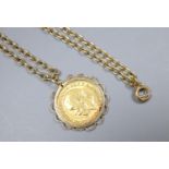 A George V 1911 gold sovereign, in yellow metal pendant mount, on a 9ct chain, gross 19.1 grams.