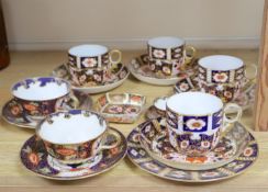 A collection of six Royal Crown Derby cups and saucers, a small square trinket dish and a