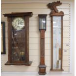 A Negretti and Zambra oak stick barometer, an admiral fitzroy barometer, a german wall clock -
