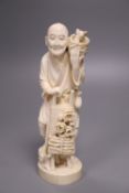 A Japanese Tokyo school ivory group of a farmer and a rabbit, Meiji period.