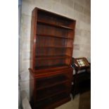 A late Victorian mahogany open fronted two section bookcase (lacking cornice), width 107cm, depth