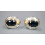 A pair of modern yellow and white metal, sapphire and diamond set oval cluster earrings, gross 3.5