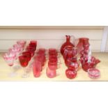A collection of Victorian and later cranberry and ruby coloured glassware, ewer 18cm