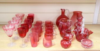 A collection of Victorian and later cranberry and ruby coloured glassware, ewer 18cm
