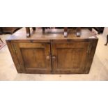 An 18th century oak two door cabinet, width 132cm, depth 44cm, height 71cm