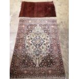 A Persian cream ground rug and a Bokhara style prayer rug, larger 144 x 100cm