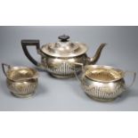 An Edwardian silver three piece tea set by Mappin & Webb, Sheffield, 1900, 1908/9, gross 32oz.