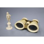 A pair of ivory binoculars and an ivory figure, height 9cm