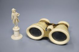 A pair of ivory binoculars and an ivory figure, height 9cm