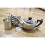 A Sterling three-piece tea service and a silver mug, gross 15oz.