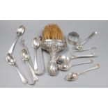 A pair of silver sugar tongs, various silver teaspoons, a sifter spoon, napkin ring and a silver-