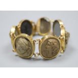 A Victorian gilt metal and lava bracelet, set with seven oval panels carved with busts of ladies and