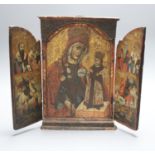 An 18th/19th century Greek/Macedonian painted and gilded wood triptych icon centred by an image of