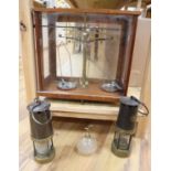 A mahogany cased set of Apothecary scales, two miner's lamps and a cut glass atomiser