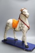 A pre-war papier mache pull-along horse