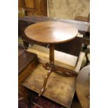 A George III circular mahogany tilt top wine table, formerly painted and later, 46cm diameter,