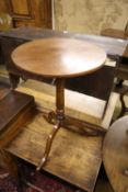 A George III circular mahogany tilt top wine table, formerly painted and later, 46cm diameter,