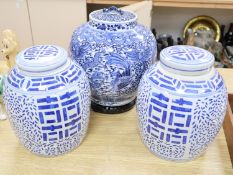 A 19th century blue and white water jar and cover, painted with dragons and birds, with inner